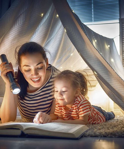 Family,Bedtime.,Mom,And,Child,Daughter,Are,Reading,A,Book