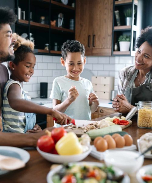 Happy,Family,In,The,Kitchen,Having,Fun,And,Cooking,Together.