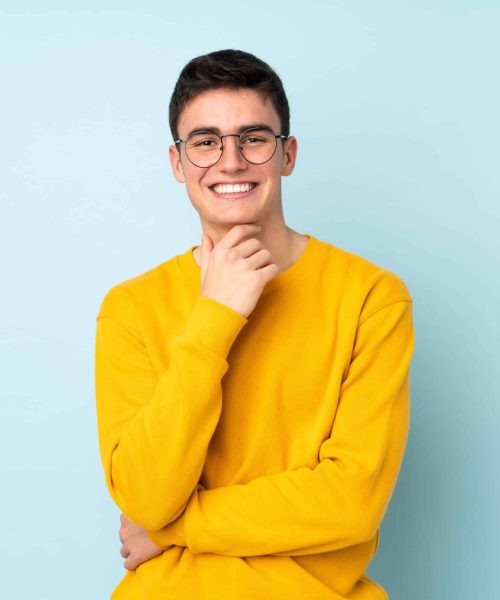 Teenager,Caucasian,Handsome,Man,Isolated,On,Purple,Background,With,Glasses