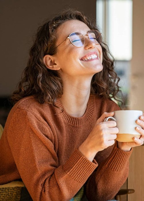 Portrait,Of,Joyful,Young,Woman,Enjoying,A,Cup,Of,Coffee